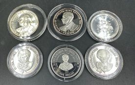 A selection of six collectable silver coins, various themes and denominations.