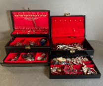 Two jewellery boxes with a selection of costume jewellery.