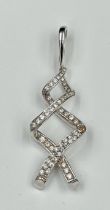 A white gold pendant, marked 750, with twisted design and white stones. Approximate total weight
