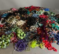 A large volume of beaded necklaces, costume jewellery