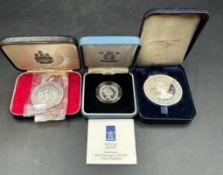 A selection of three silver proof coins