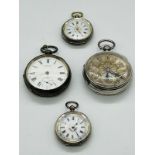 A selection of four silver pocket watches various styles, finishes and ages.