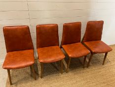 Four vinyl and teak chairs in the style of Adrian Pearsall