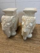 A pair of white ceramic elephant themed plant stands. H 40cm