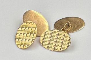 A pair of 9ct gold Gents cuff links in oval form with diamond cut decoration, approximate total