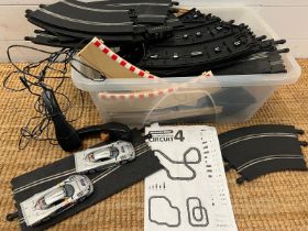 A Scalextric circuit 4, track and two cars, unboxed