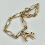 A 9ct gold bracelet with open links and a cat themed charm, approximate total weight 10.2g