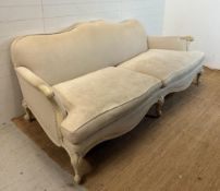 A four seater Louis style sofa with white painted frame and studded beige upholstery (224cm x
