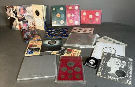 A selection of coin collectors packs to include: The Millennium coin x 2, Silver Jubilee coinage,