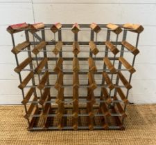 A wooden thirty six bottle wine rack