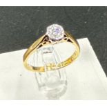 An 18ct yellow gold and platinum set diamond ring, approximate size J1/2