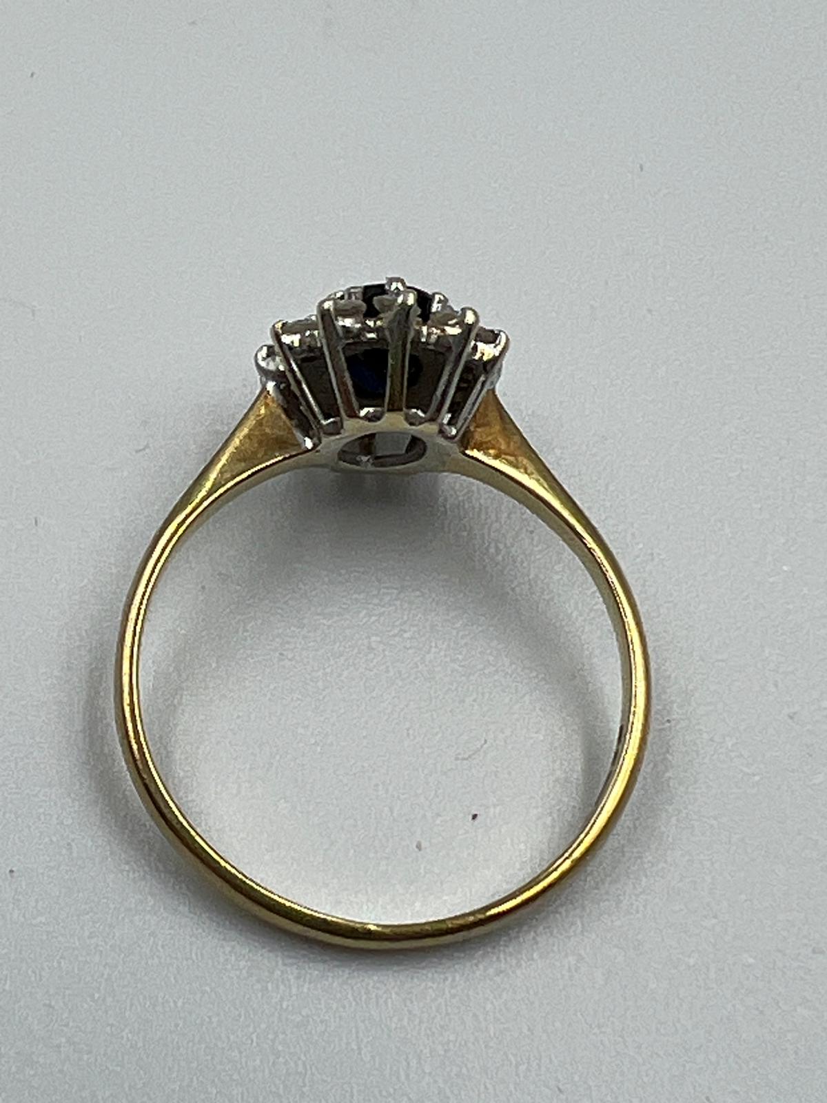 A 9ct gold sapphire and diamond ring in a daisy style, approximate size L. - Image 6 of 7