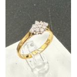 A 9ct gold ring with diamond cluster setting, approximate total weight 2.5g, size N