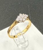 A 9ct gold ring with diamond cluster setting, approximate total weight 2.5g, size N