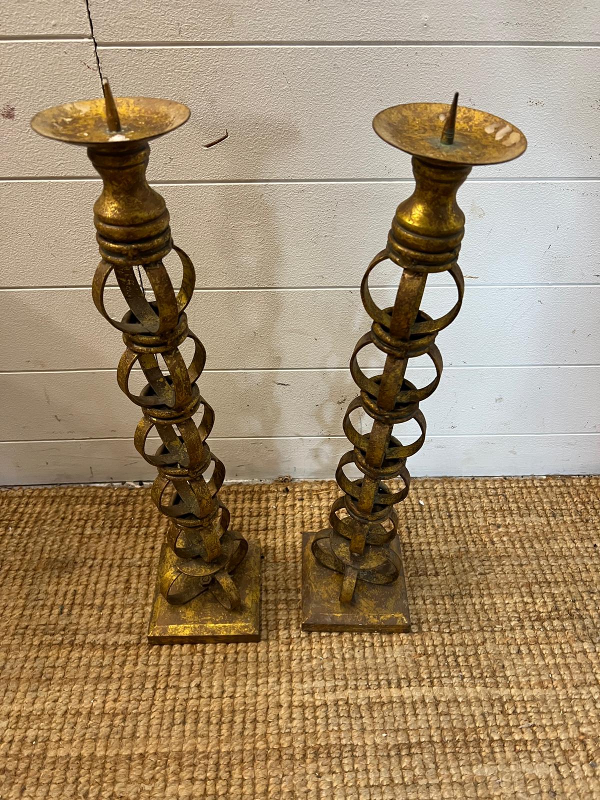 A pair of metal candlesticks (H60cm)