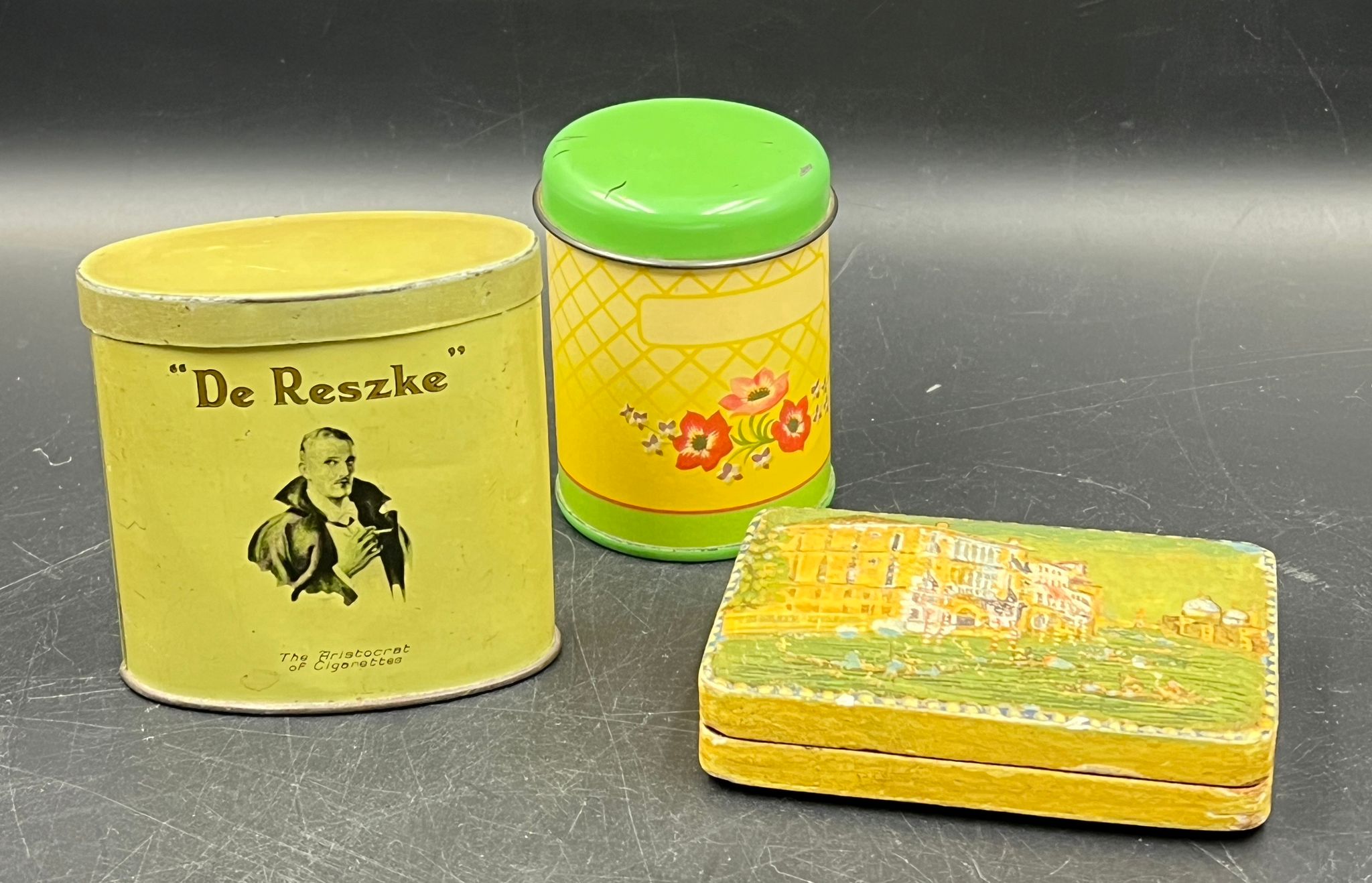 A selection vintage tins and a wooden painted case