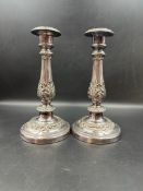 A pair of quality silverplate candlesticks with weighted bases and foliate design, (Height 22cm)