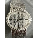 A Ladies 18ct gold and diamond Omega watch, textured white dial, black hourly makers, a 17 jewel