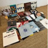A selection of vinyl LP to include The Beatles Help, Chic and Phil Collins