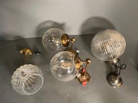 Four globe style, wall hanging lights and ceiling lights