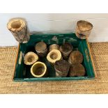 A selection of wooden rustic candle holders and logs
