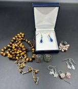 A selection of costume jewellery to include silver earrings etc.