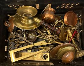 A selection of brass and copper items to include toasting forks, candle sticks and door furniture