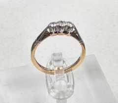 A 9ct gold and platinum three stone diamond ring, size L.