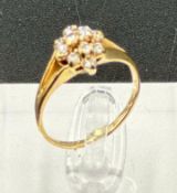 A 9ct gold and diamond ring, approximate size M