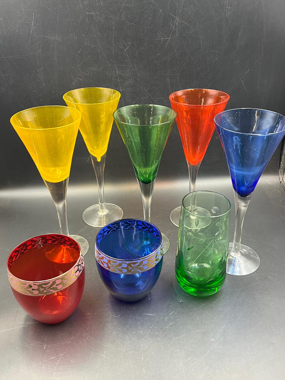 A selection of coloured glass to include six flutes.