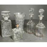A selection of cut glass decanters and a vase