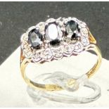 A 9ct gold diamond and sapphire ring, approximate size M1/2