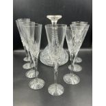 A selection of various glassware to include ships decanter, champagne flutes etc.