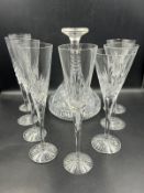 A selection of various glassware to include ships decanter, champagne flutes etc.