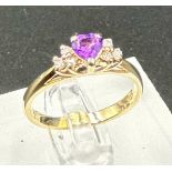 A 14ct gold amethyst and diamond shoulders with a heart shaped central stone on a 14ct yellow gold