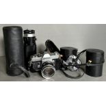 A Canon FT QL 35mm camera and three extra lenses to include a Tamron telescope