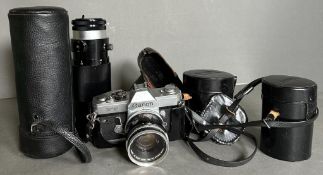 A Canon FT QL 35mm camera and three extra lenses to include a Tamron telescope