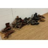 Nine sets of vintage ice skates various styles and sizes