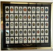 A framed selection of Wills cigarette cards 54cm x 49cm