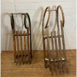 A metal framed vintage sled and a Bentwood vintage sled