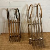 A metal framed vintage sled and a Bentwood vintage sled