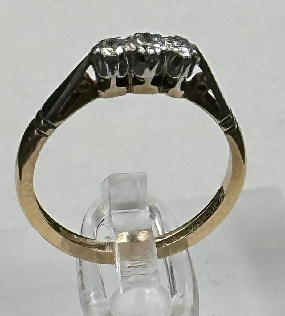 A 9ct gold and platinum three stone diamond ring, size L. - Image 6 of 6