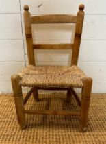 A pine rush seated child chair