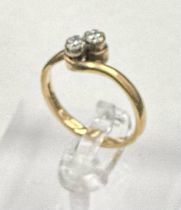 A two stone diamond ring on a 9ct gold setting, approximate size P and weight 2.6g.