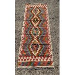 A Chobi Kilim runner 183cm x 69cm