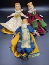 Three puppet style dolls with wooden heads and feet