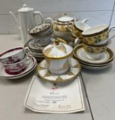 A mixed selection of china tea cups and teapots, various makers