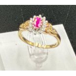 A 9ct gold ruby and diamond ornate ring in yellow gold setting, approximate size O1/2