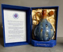 A Rangers Football Club Whisky Wade Decanter. The whisky has been produced in the traditional Pot