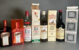 A selection of boxed spirits to include: Cointreau, Dry Sack sherry, Famous Grouse Scotch whisky,